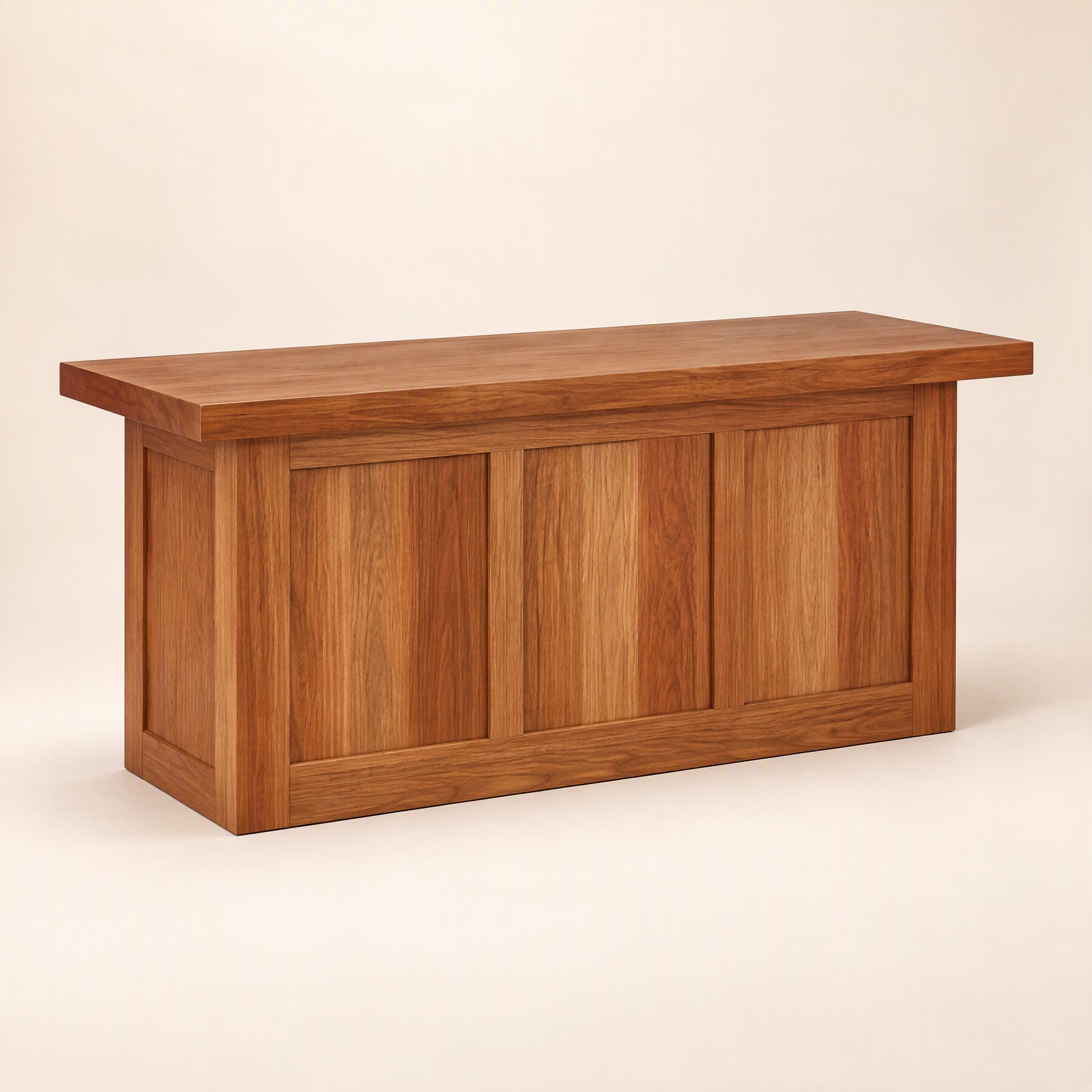 A solid-timber altar table on a panelled base, three panels across the front