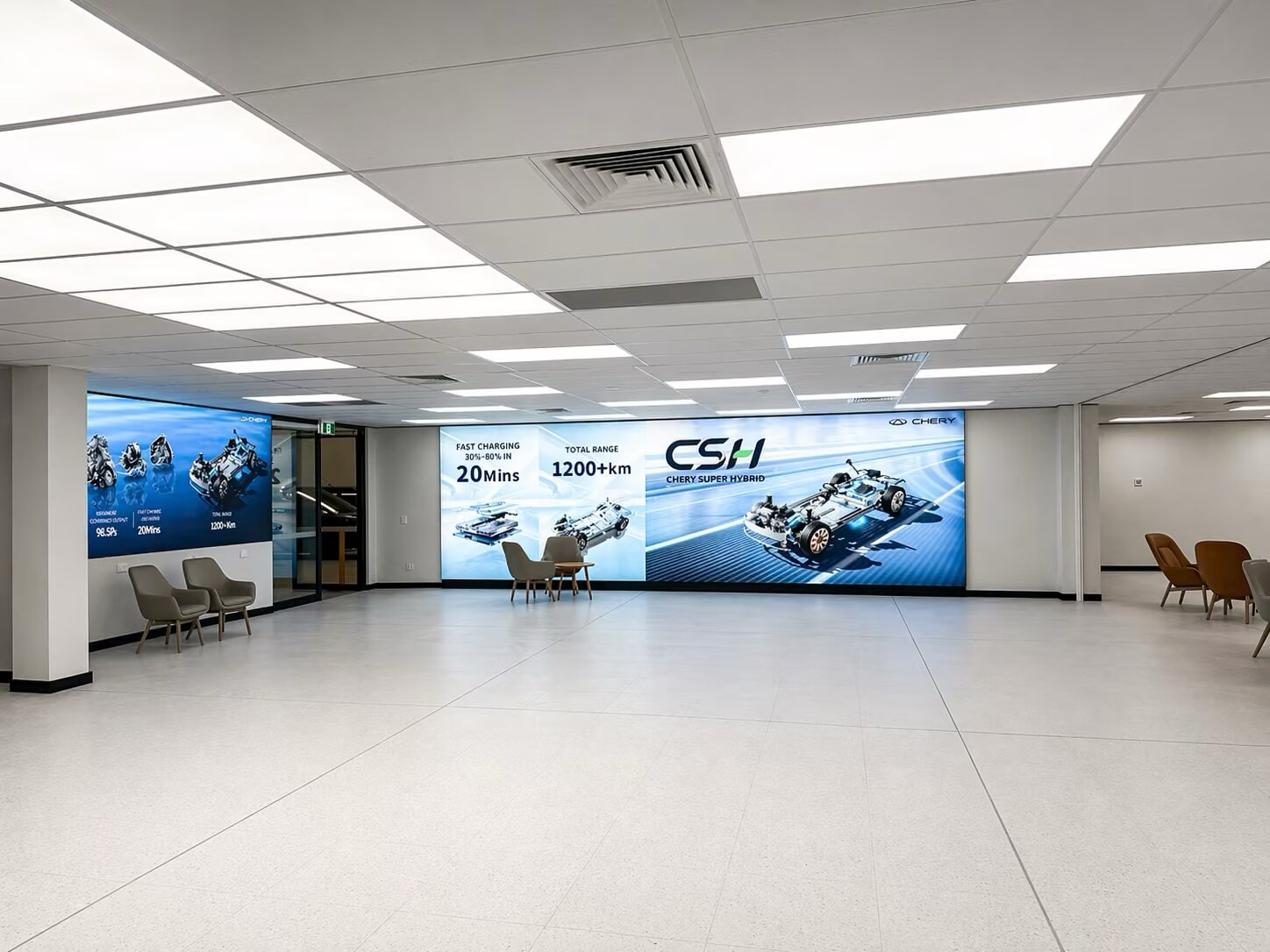 Open showroom floor with a backlit display wall and seating groups