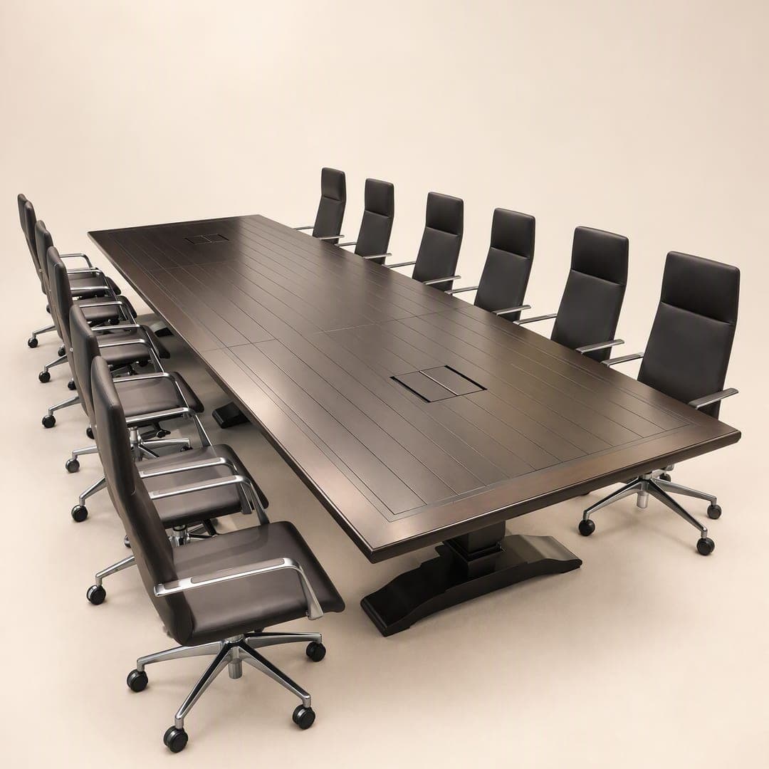 A long boardroom table with a dark timber top, ringed by leather office chairs